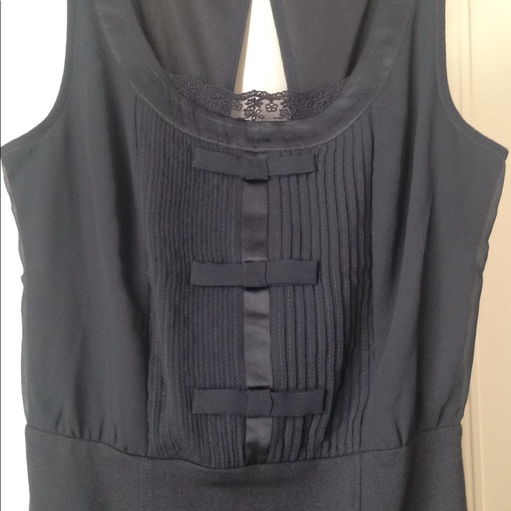 Black mid length dress with tuxedo type details